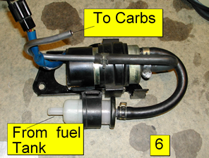 Fuel pump on top with fuel filter below it.